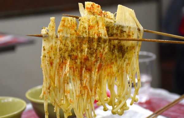 Chop sticks with mushrooms and other food during the 'Untour Shanghai'.