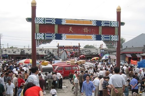 Enjoying a market in China as a solo traveler.