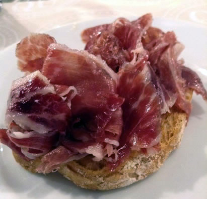 Jamon shavings on bread in Barcelona.