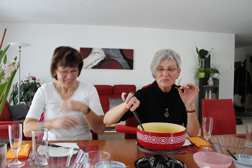 Eating cheese fondue.