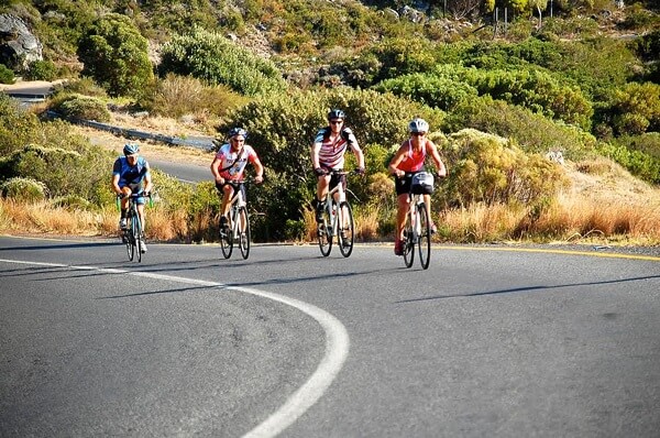 Here the author is Cycling on a hilly road on her way through South Africa.