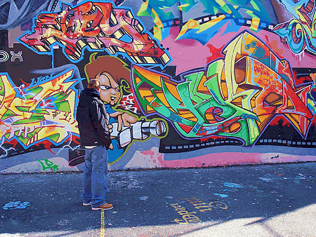 Sons checking out graffiti art.