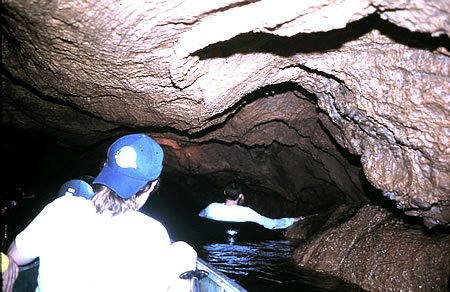 Sons in cave in Belize with family.