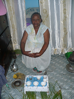 Ethiopia woman serving coffee.