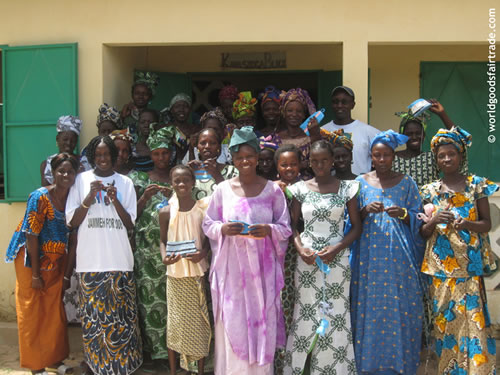 Skills Centre women are holding plastic purses