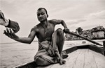Man rowing boat in Varanasi, India