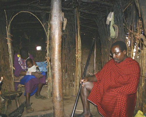 Moses, the village elder, at his home.