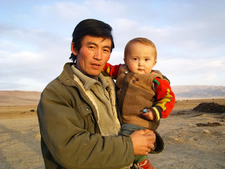 Father holding his son.