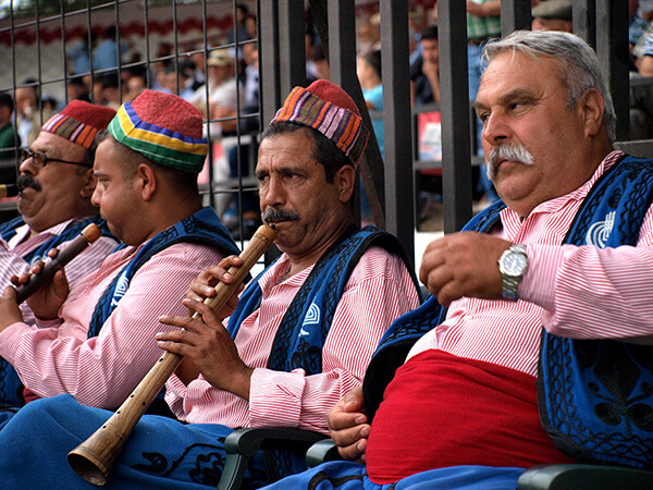 Men playing music in costume in Turkey.