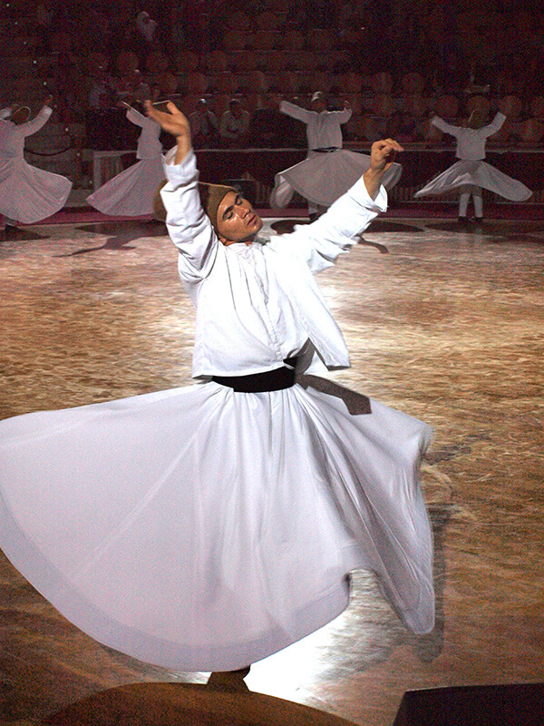 Whirling dervishes by men in Turkey.