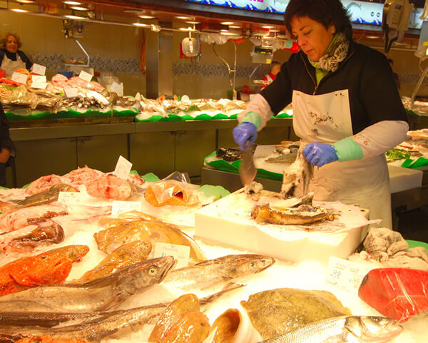 The Barcelona cooking class went shopping for squid at the fish market.