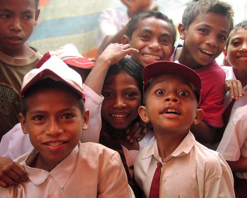 Welcoming schoolboys in the village in Indonesia.