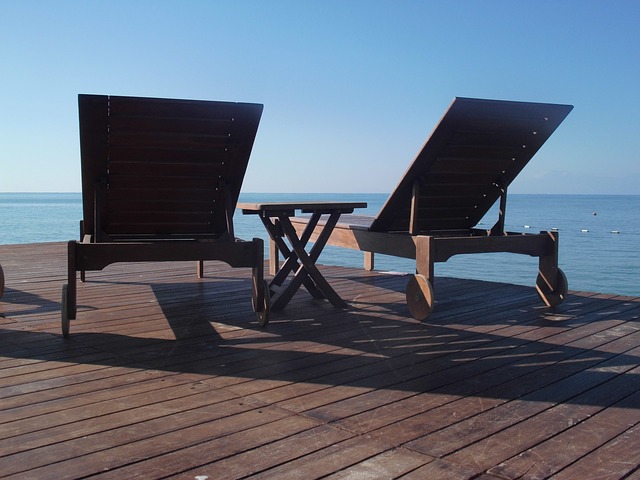 Chairs on deck with sea view for relaxation or work thumbnail.