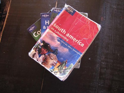 Covers of a pile guidebooks.