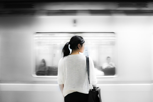 Woman taking a subway to a job in Tokyo, Japan.