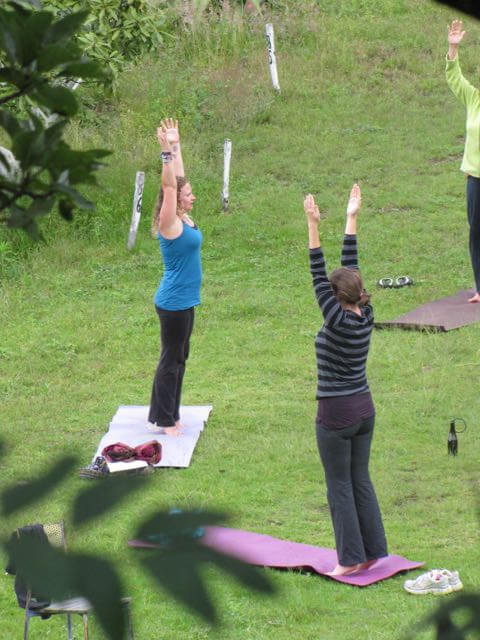 You can even find jobs teach yoga abroad, here with a class outside.