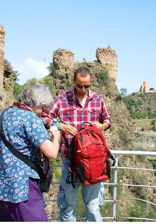 Dario handing out water bottles during a tour.