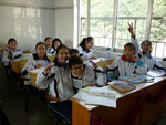 Children learning English in a classroom in China.