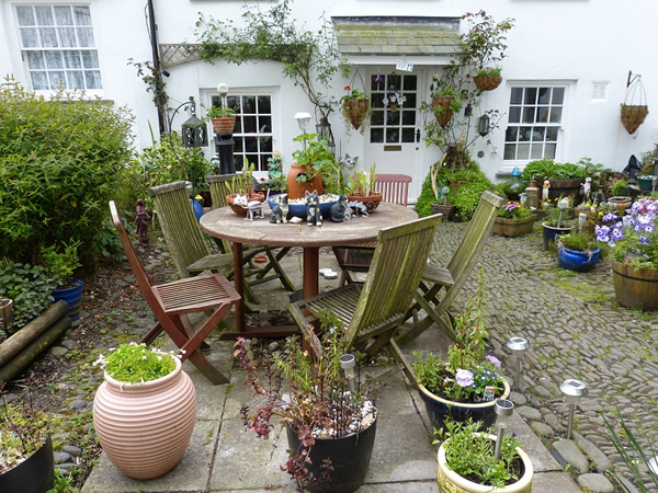 House sitting jobs in England with patio and plants.