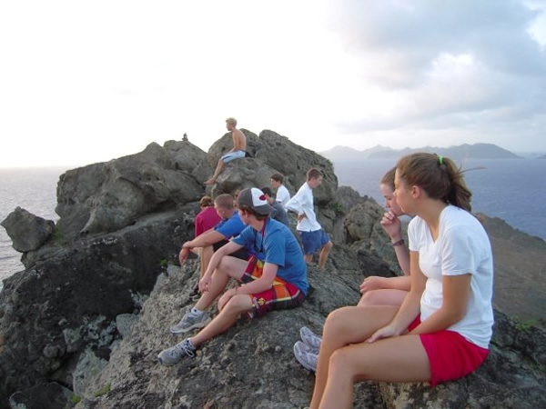 Sitting on a rocky perch overlooking the ocean while working with teens on tour in St Martin.