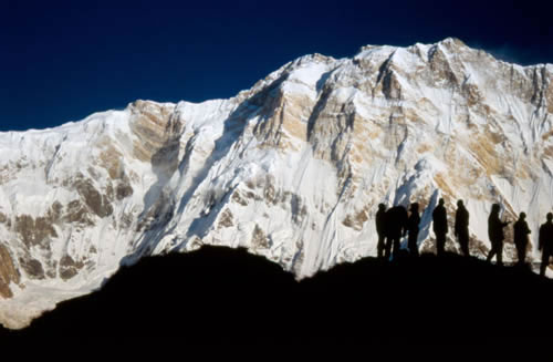 Annapurna, Nepal mountain walkers led by a tour guide