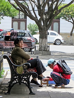Bolivian child shining shoes