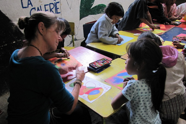 Volunteer teaching children in Guatemala.
