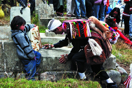 Dancer at a graveside of the former member of the group.