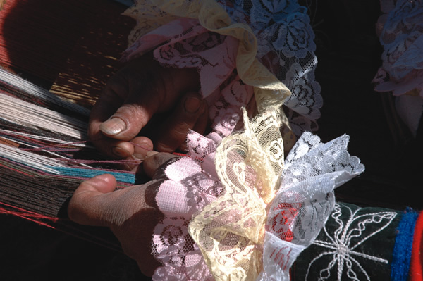 The hands of a weaver in action
