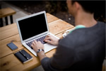 Create an international resume. Man on his laptop.