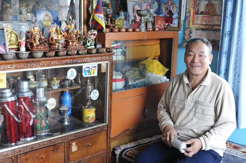 Host dad in prayer room in Dharamsala