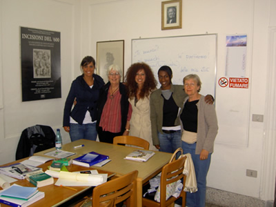 Author in language class with classmates and teacher in Urbania, Italy.