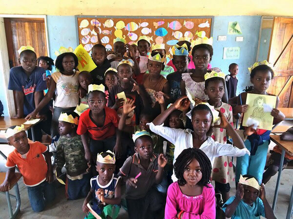 Teaching children of all ages in classroom in Zambia.
